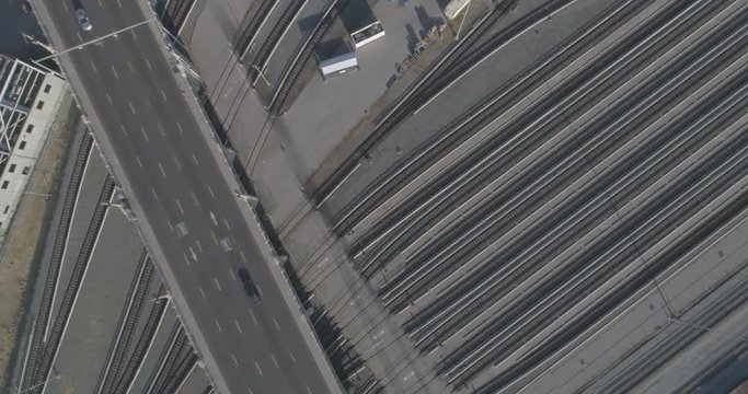 Aerial over train tracks tilt up to downtown Los Angeles