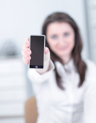 closeup. business woman showing a blank business card