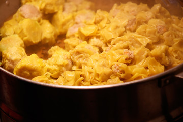 Chiang Mai, Thailand - April 8, 2018 : Street food (Pork Dumpling with steam) at the Sunday Night Market Walking Street on April 8, 2018 in Chiang Mai, Thailand. Selective focus.