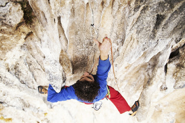 Rock-climbing in Turkey. The climber climbs on the route. Photo from the top.