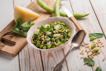 sheep cheese with broad beans pine nuts and mint leaf