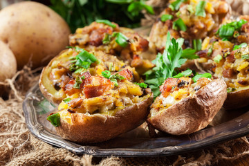 Baked potatoes stuffed with bacon, mushrooms and cheese