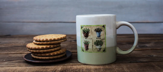 cookies and tea on wooden background