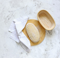 Dough for bread on leaven, yeast, in baskets for proofing dough.