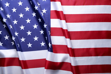 Close up of ruffled American flag. Patriots day, memorial weekend, veterans day, presidents day, independence day background. United States of America national stars and stripes symbol. Copy space.