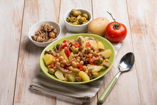 salad with chickpeas potatoes tomatoes mushroom and olives