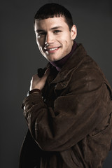 Obraz premium Portrait of satisfied man with attractive smile isolated on black background. Positive concept