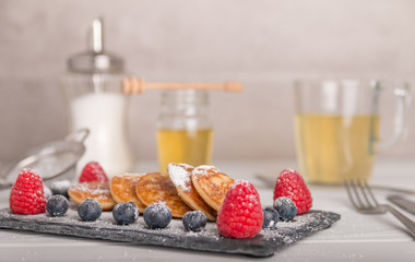 mini pancakes with fruit and honey