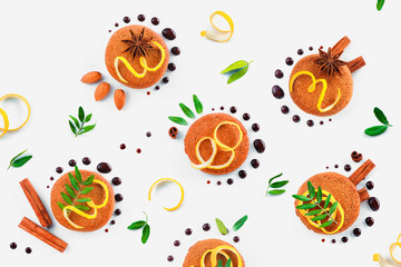 Oatmeal cookie pattern flat lay. Food styling tips pattern made of cookies, chocolate swooshes and rings, cinnamon, lemon zest and green leaves.