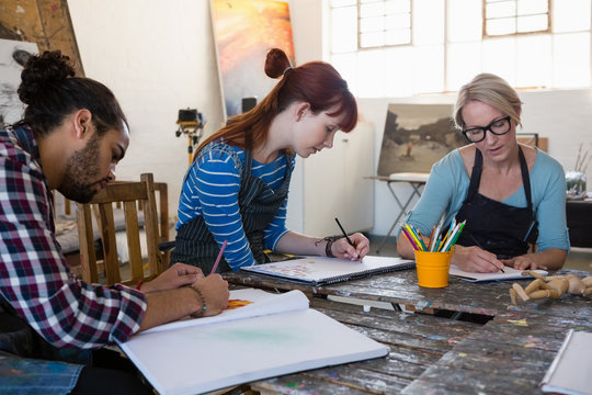 Adult student practicing drawing in art class