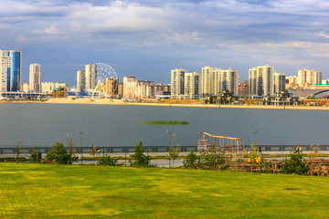Fototapeta premium Storm clouds on a summer day over the city waterfront in Kazan