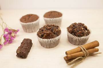 Chocolate muffins on a white table 