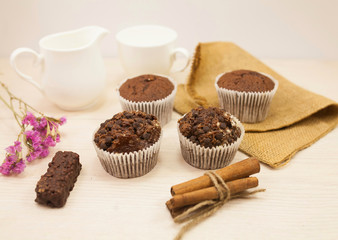 Chocolate muffins on a white table 