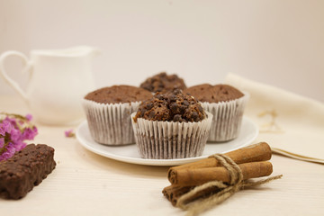 Chocolate muffin on white background. Kitchen table