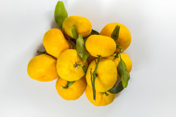 Fresh orange fruit that separates the white background.