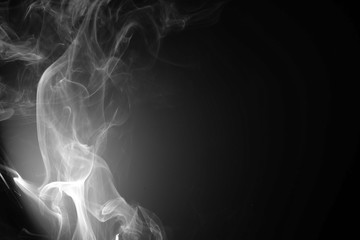 Fototapeta na wymiar Abstract beautiful smoke on a black background