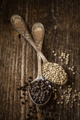 pepper peas dry black and white on wooden background