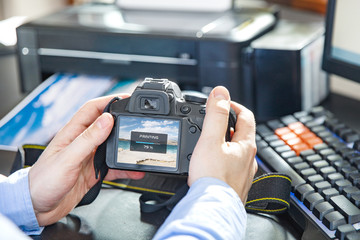 Businessman sends a photo to wireless printer by camera