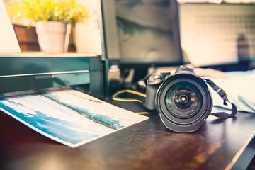 Unknown camera and photo printer on the graphic desk
