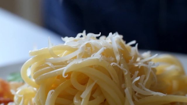 Super Macro - Grated Parmesan Cheese Falling On Spaghetti