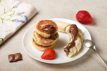 Breakfast pancakes, cooking, fruits, blueberries, strawberries, sour cream, sugar, cottage cheese, flour, eggs, banana, chocolate