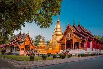 Stunning Wat Phra Singh Woramahawihan Buddhist Temple at sunrise in Chiang Mai, Thailand - obrazy, fototapety, plakaty