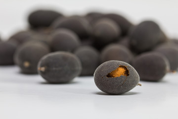 The Velvet tamarind ( Dialium cochinchinense ) Fruit native Thailand, isolated on white background