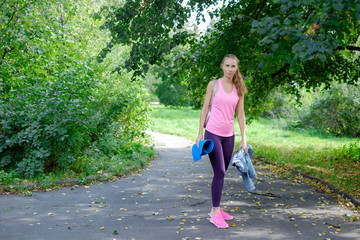 Woman came to the park to do yoga in nature