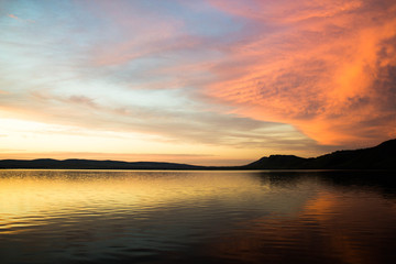Fototapeta na wymiar Colorful sunset over the sea surface.