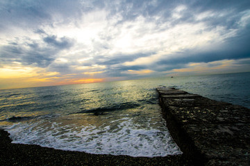  Sunset on a stone pier.