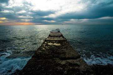  Sunset on a stone pier.