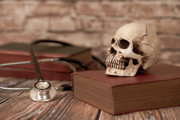 skull with old text book ,concept with medical education .
