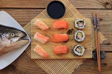 Sushi is a tasty typical Japanese dish made with rice and fish or seafood, usually raw, such as salmon or tuna
