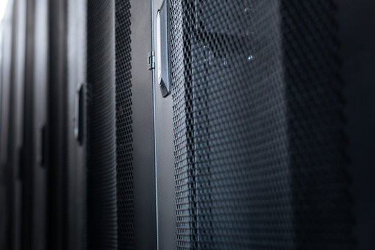 Important cabinets. Black metal stylish modern server cabinets in a data center