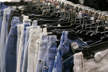 Fototapeta premium Fashionable clothes shop - pants choice