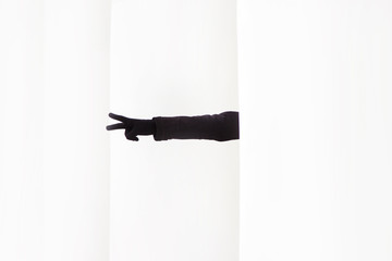 Hand gestures in a glove on a white background