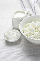 Obraz na płótnie Canvas dairy products, cottage cheese, milk, yogurt, sour cream in white dishes.