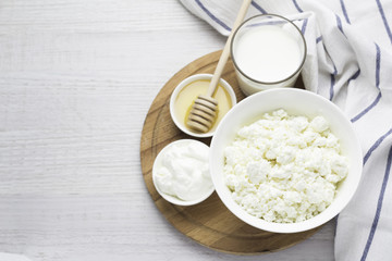 dairy products, cottage cheese, yoghurt, sour cream, milk, honey and space for text.