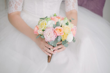 Posy bridal bouquet of eucalyptus, eustoma and roses