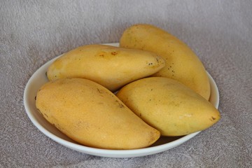 Mango,  it is the fruit that has sour.