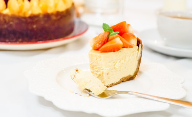slice of strawberry cheesecake selective focus