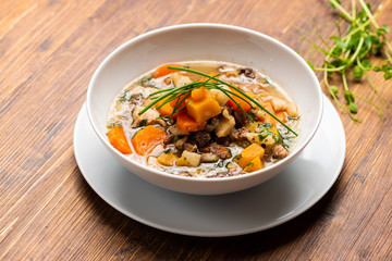 big pot of soup with beef and fresh vegetables