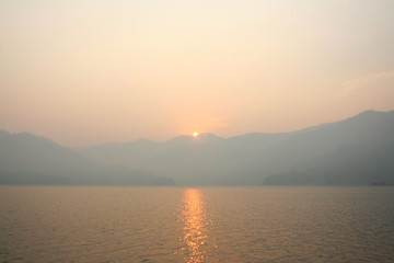 sunrise view with mountains and lake landscape in the morning natural outdoor background