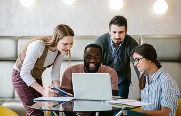 Business team in office look in laptop. Start up project. Education.
