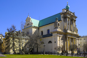 Obraz premium Warsaw, Poland - Historic quarter of Warsaw old town - Carmelite Church of the Assumption of Virgin Mary and of St. Joseph at Krakowskie Przedmiescie street