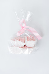 Pink marshmallows, handmade sweets, zephyr, soft confectionery, candy on a light background. Sweet marshmallow.