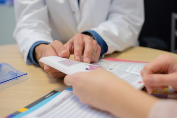 Dr and patient looking at booklet