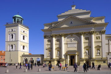 Obraz premium Warsaw, Poland - Historic quarter of Warsaw old town - St. Anne Church at Krakowskie Przedmiescie street