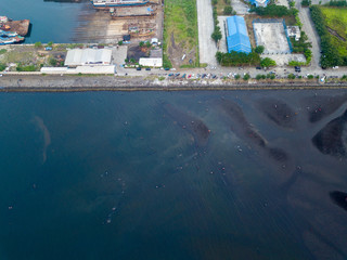 Dock station for tradditional shipyard with lot of boats and ships, photo from drone at bird eye view