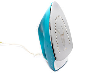 Electric steam iron standing upright on a white background